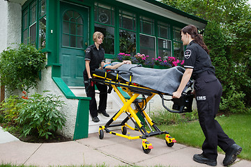 Image showing Ambulance Workers with Senior Woman