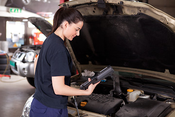 Image showing Woman Mechanic with Diagnostics Tool