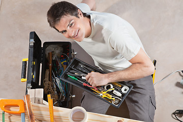 Image showing Man holding tool box