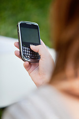 Image showing Girl using cell phone