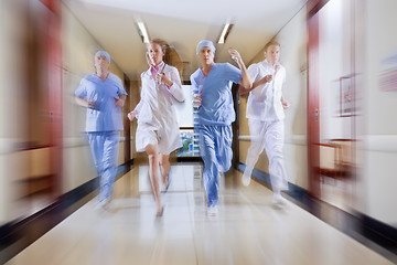 Image showing Surgeon and nurse running