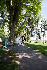 Image showing Newlywed Running Along Walkway