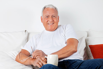 Image showing Relaxed Senior Man Having with Warm Drink