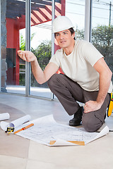 Image showing Construction worker with project paper