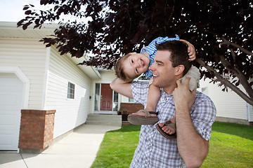 Image showing Father With Little Son on His Shoulders