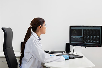 Image showing Dentist working on computer