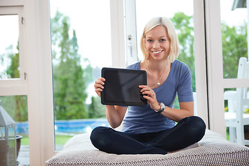 Image showing Young female holding tablet pc