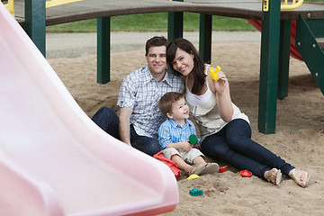 Image showing Couple Sitting With Their Son in Playground