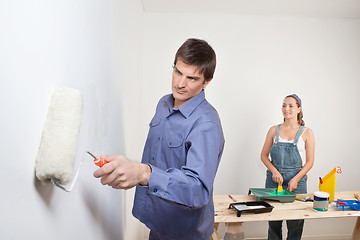 Image showing Portrait of young couple painting