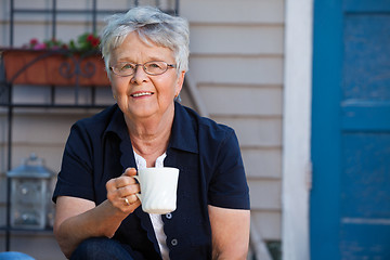 Image showing Senior woman having tea
