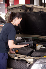 Image showing Woman Mechanic with Engine Diagnostics Tool