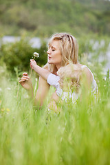 Image showing Mother and Son in Meadow Making Wishes