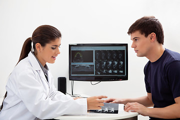 Image showing Dentist discussing report