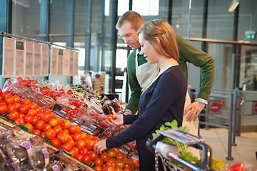 Image showing Woman buying tomatoes