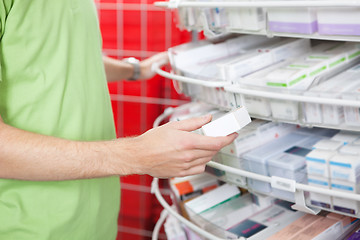 Image showing Man Holding Medication Box