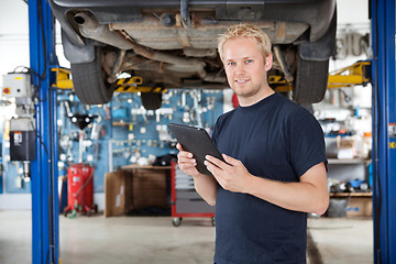 Image showing Mechanic with digital tablet