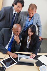 Image showing Business team working on laptop together