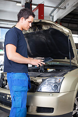 Image showing Mechanic with digital tablet