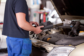 Image showing Mechanic with Diagnostic Equipment