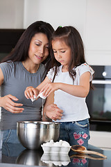Image showing Mother and Daughter Baking