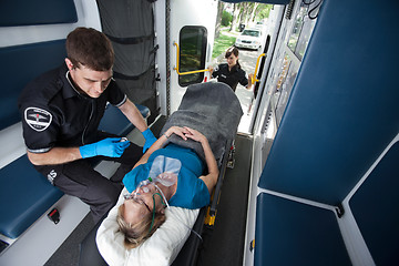 Image showing Senior Woman Receiving Emergency Medical Care