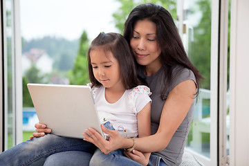 Image showing Cute daughter and mother with laptop