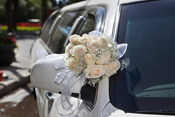 Image showing Wedding Bouquet on Limo