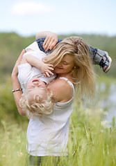 Image showing Mother and Son Playing in Meadow