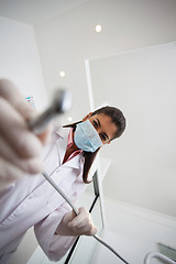 Image showing Female dentist holding drill