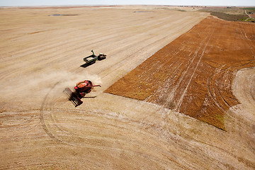 Image showing Grain Cart and Combine on Prairie Field