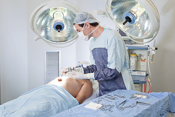 Image showing Doctor performing operation