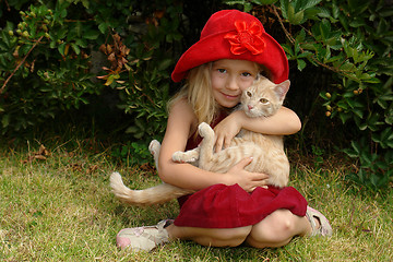 Image showing the girl in red hat with a cat