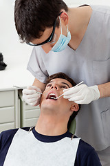 Image showing Dentist treating patient