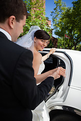 Image showing Bride and Groom with Limo