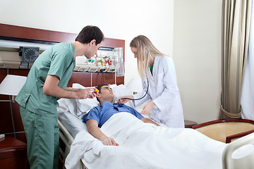 Image showing Doctor examining patient