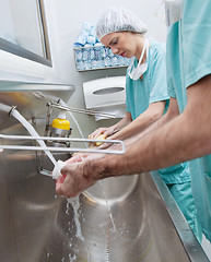 Image showing Surgeons washing hands