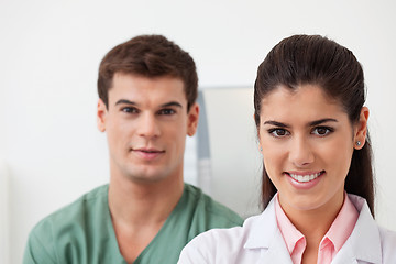 Image showing Female doctor with colleague standing behind