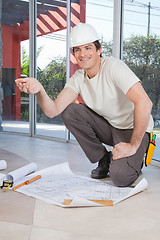 Image showing Construction worker with blueprint