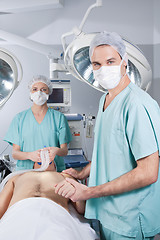 Image showing Surgeon nursing the patient