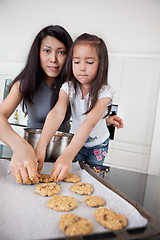 Image showing Mother and child making cookies