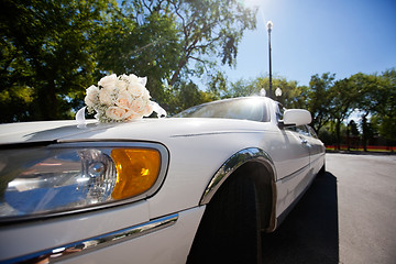 Image showing Wedding bouquet on the car