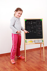 Image showing Cute girl doing math