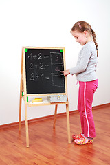 Image showing Cute girl doing math