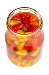 Image showing canned peppers in a glass jar isolated on white background