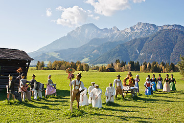 Image showing Group of scarecrows in female dress standing on a field