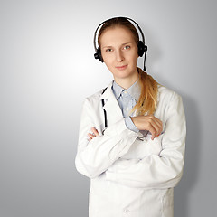 Image showing doctor woman with headphones smile at camera