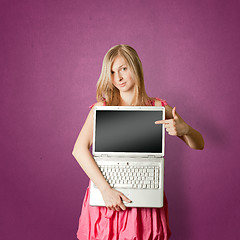Image showing femaile in pink with open laptop