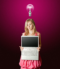 Image showing femaile in pink with open laptop