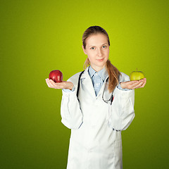 Image showing female doctor with two apples