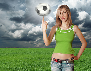 Image showing happy girl with soccer ball on blue sky